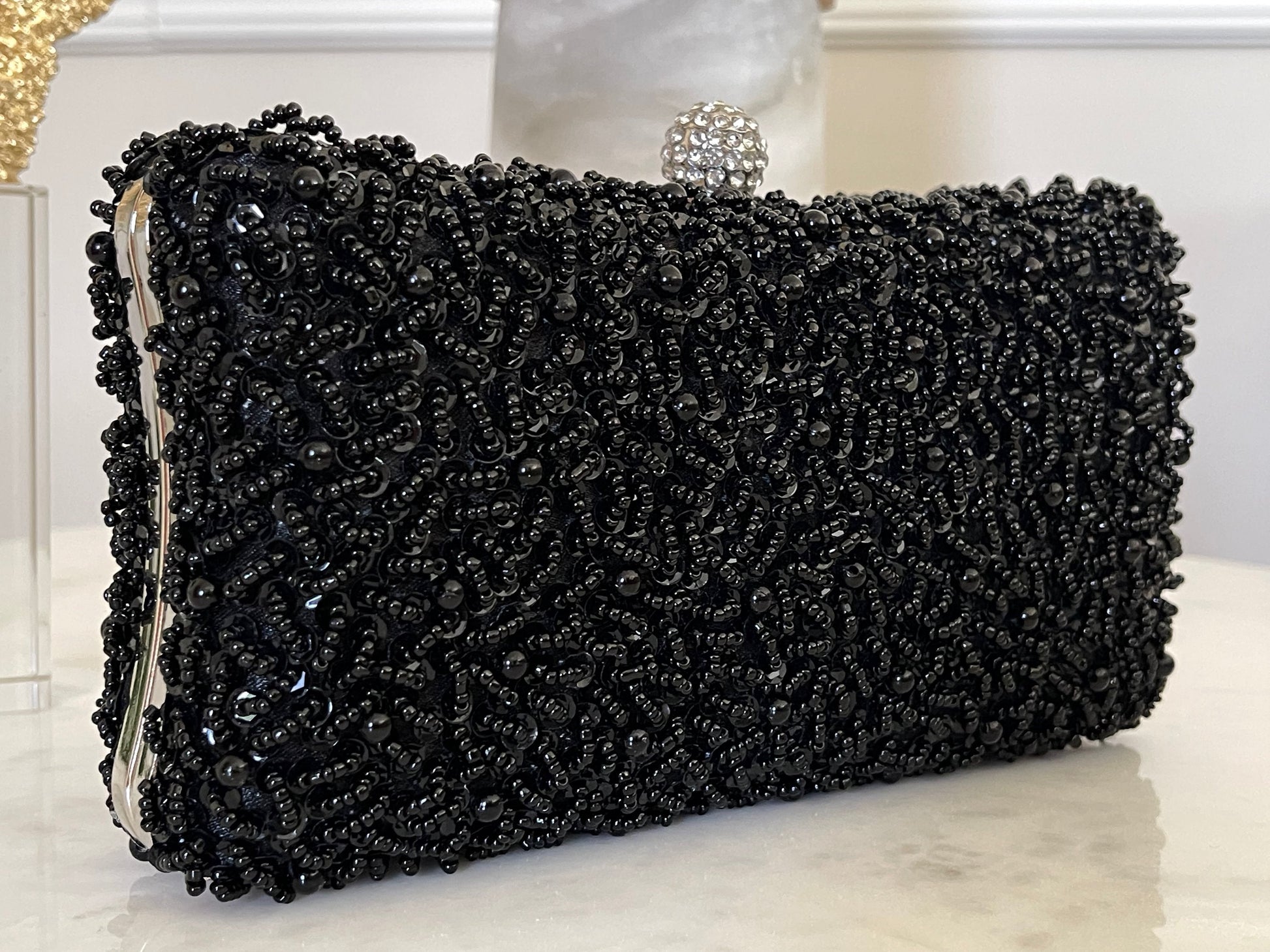 Front view of the Black Beaded Embroidered Clutch Purse against a neutral background, highlighting its elegant silhouette