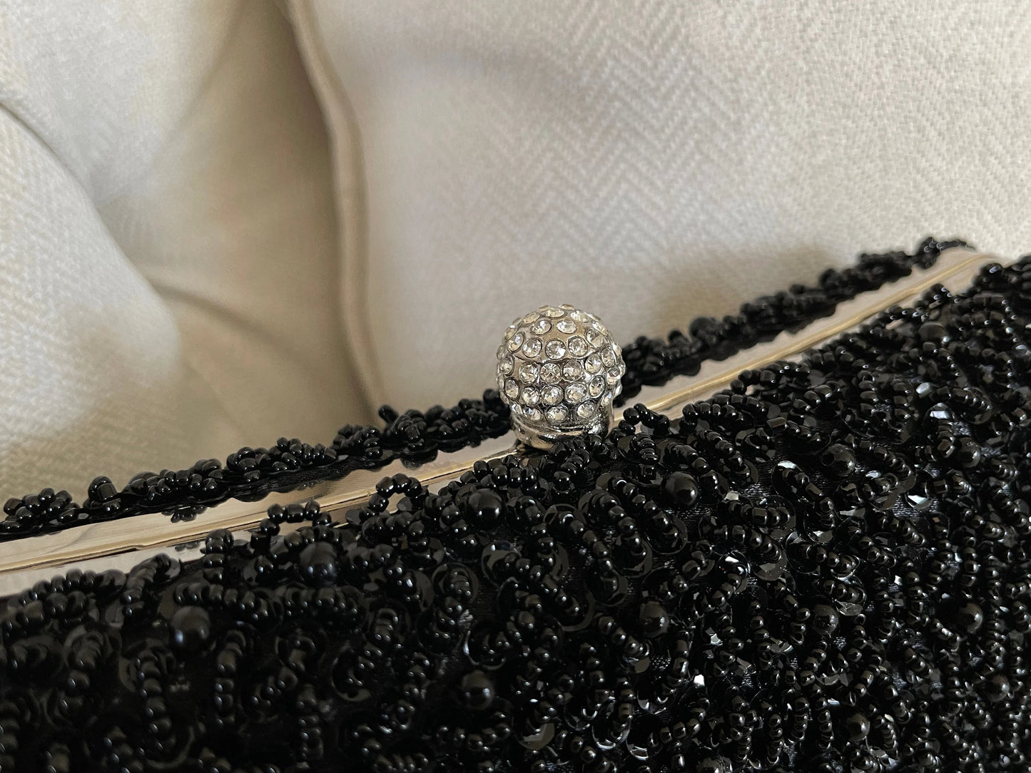 Top view of the Black Beaded Embroidered Clutch Purse on a marble background, showing dimensions and detailed embroidery