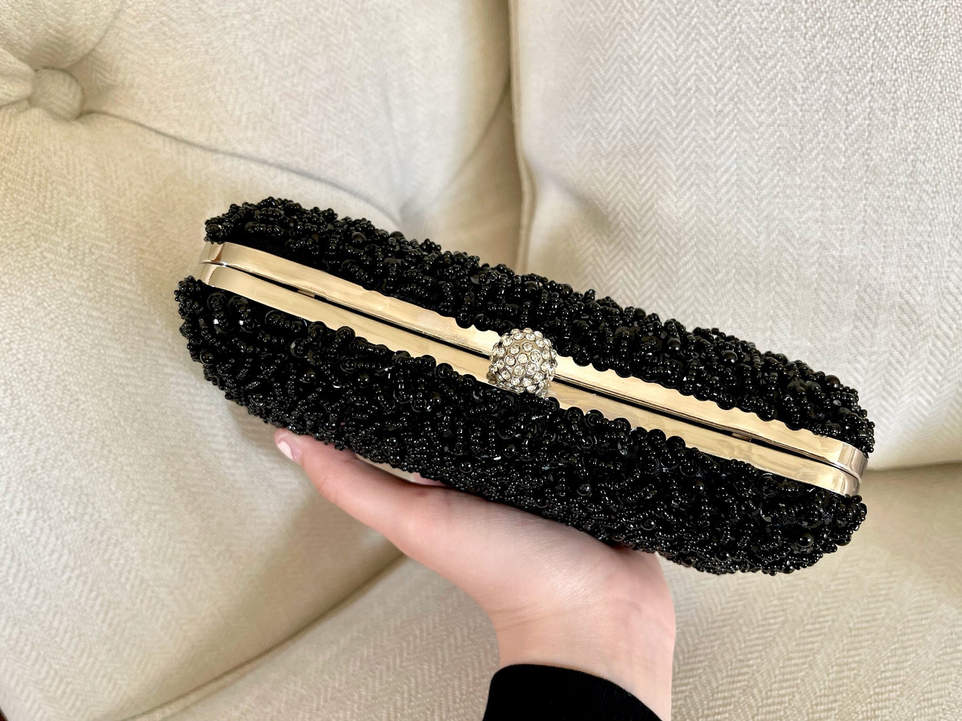 Top view of the Black Beaded Embroidered Clutch Purse on a marble background, showing dimensions and detailed embroidery