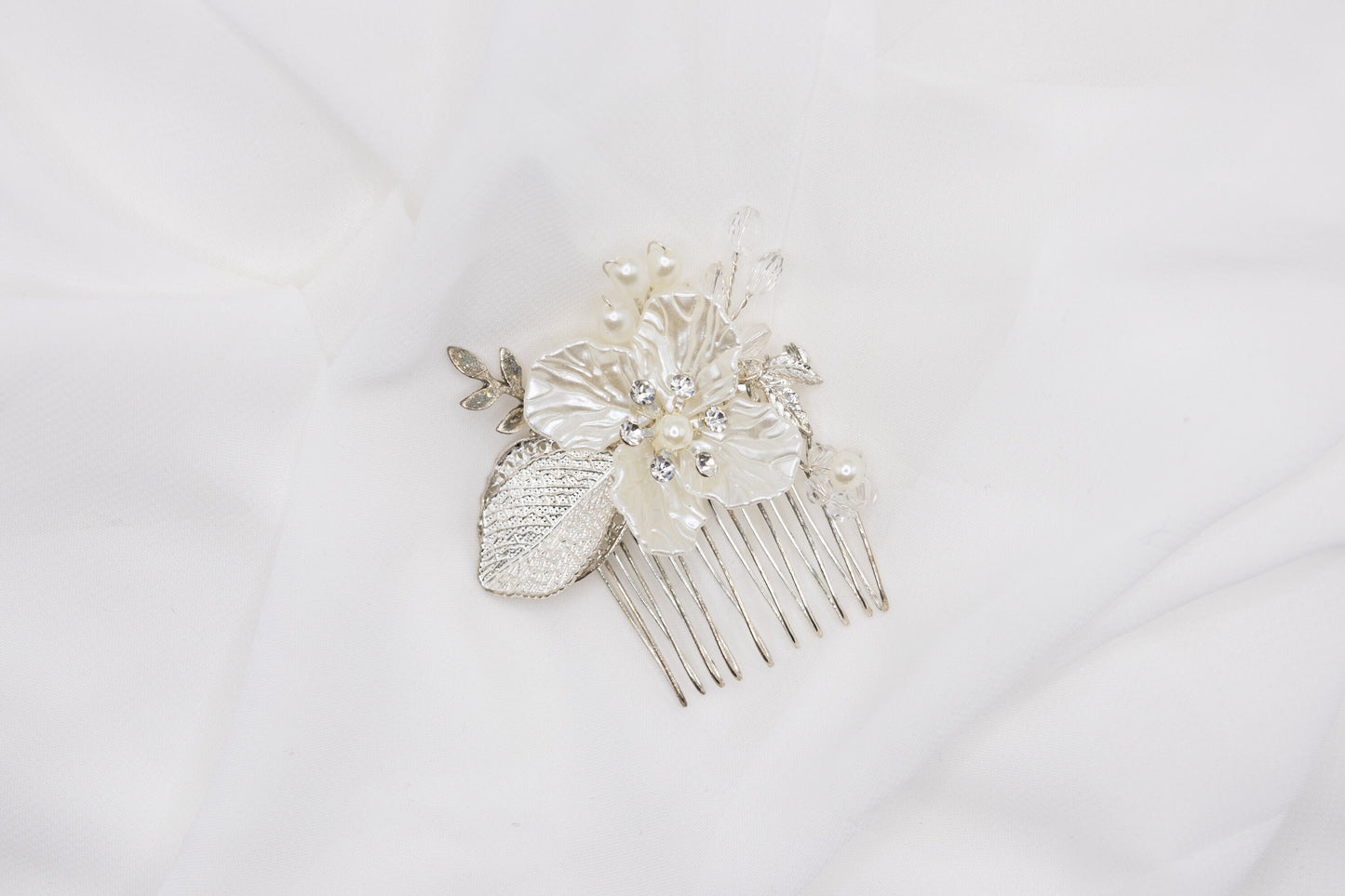 Sophisticated floral wedding hair pin in silver plating, embellished with high-quality rhinestones, displayed against a white background.